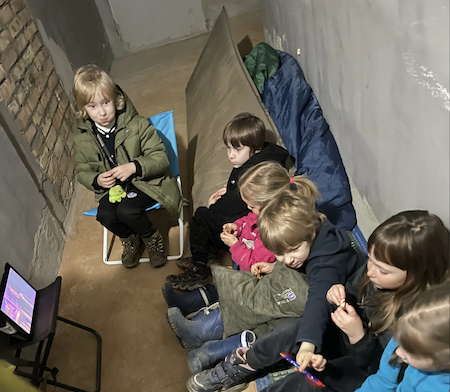 Andrii's family in a bomb shelter.