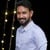 Dinesh B.