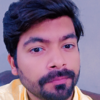 Mujahid K.