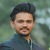 Dinesh B.