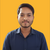 Dinesh B.