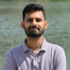 Akshya K.